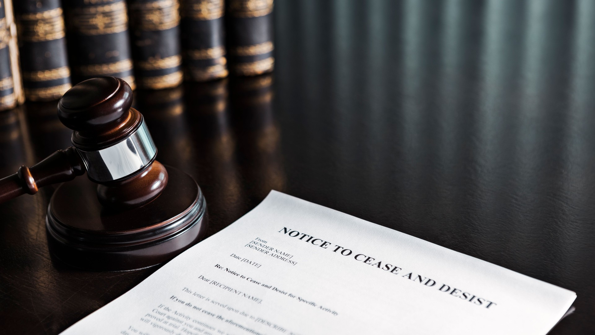Cease and Desist Letter with Gavel and Books